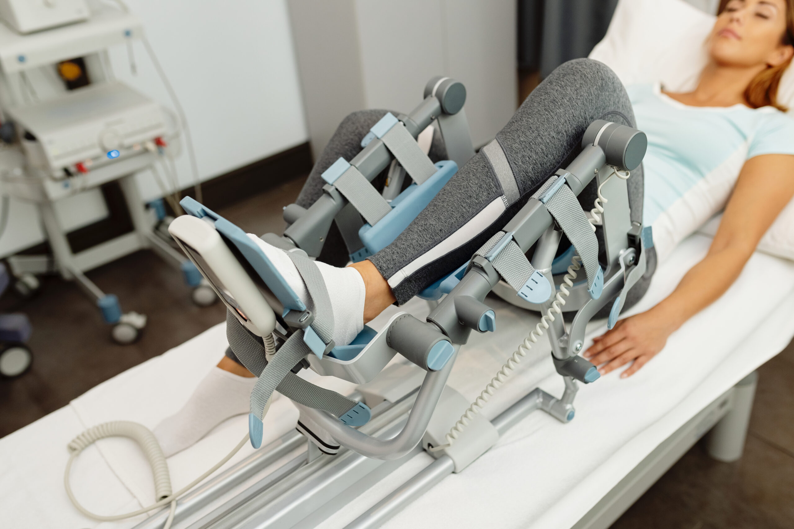 Close-up of woman during physical rehabilitation with arthromot